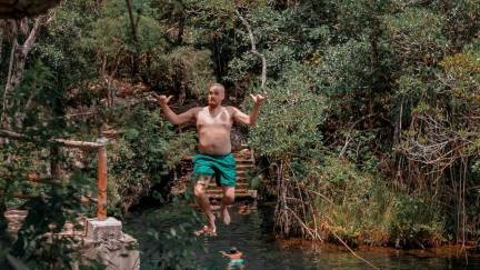 Man jumping into a cenote