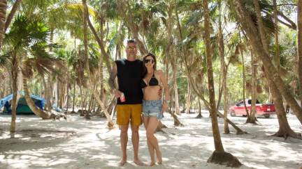 Visitors posing for a photo at the beach