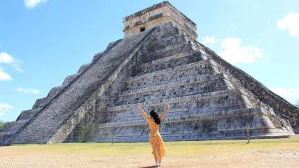 Visitor in front of a pyramid