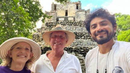 Visitors with the tour guide at the Muyil ruins