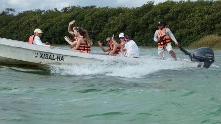 Group on a boat on the Sian Ka'an lazy river channels