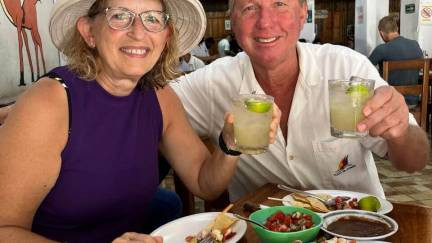 Visitors enjoying a traditional Mexican meal and drinks